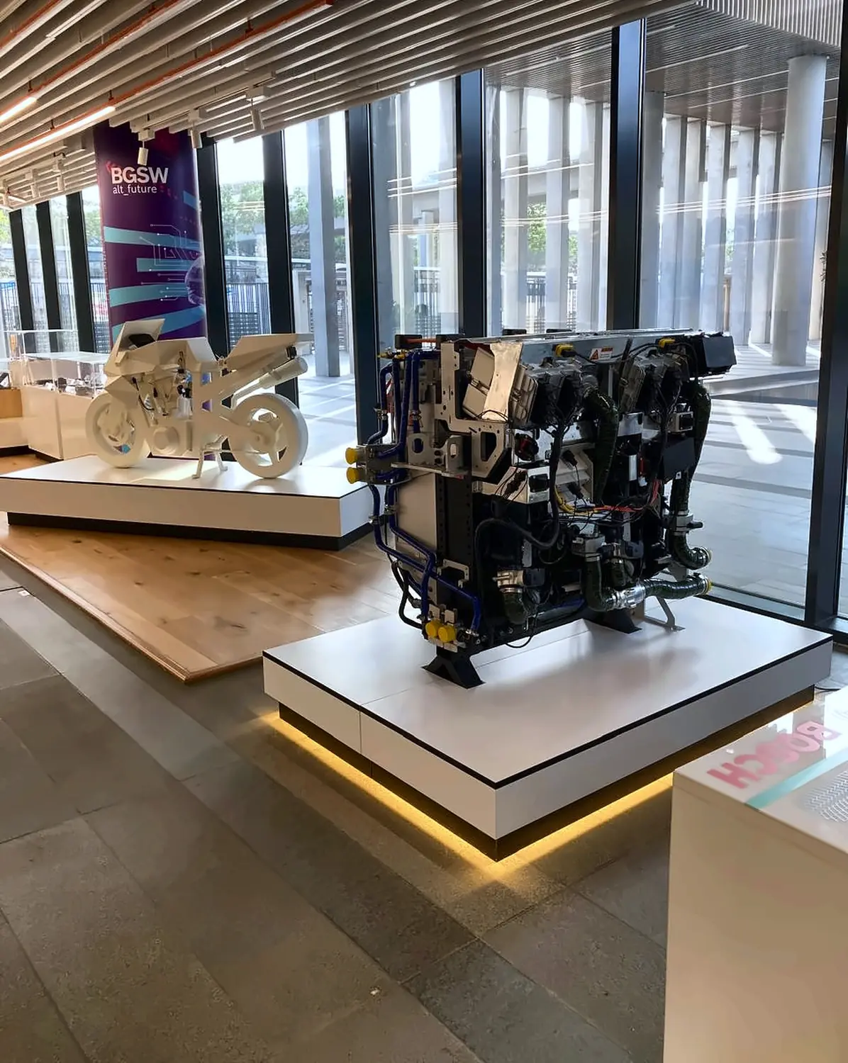 Full-size engine replica and a motorcycle showpiece on display
