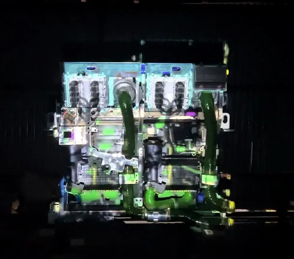 Projection mapping in blue and green light on a fuel cell engine replica
