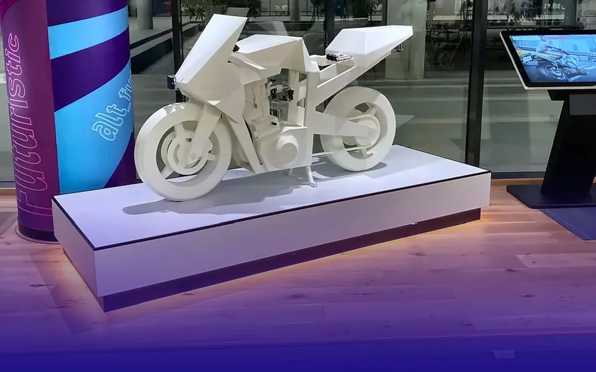 3D-printed motorcycle showpiece on a lit plinth